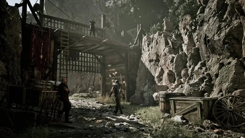 Mining Colony gameplay scene from Gothic 1 Remake, showing the rocky settlement and timber structures